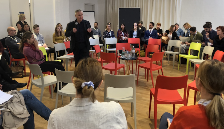 Friso Roscam Abbing speaking with a group of people in the round at FRA.