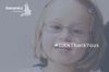A girl smiling at the camera. A still from a film produced for Genomics England by Restless Communications