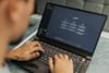 Person using a laptop with the ChatGPT interface on screen, representing how AI assistants are becoming a major driver of web traffic.