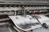 A newspaper being printed.